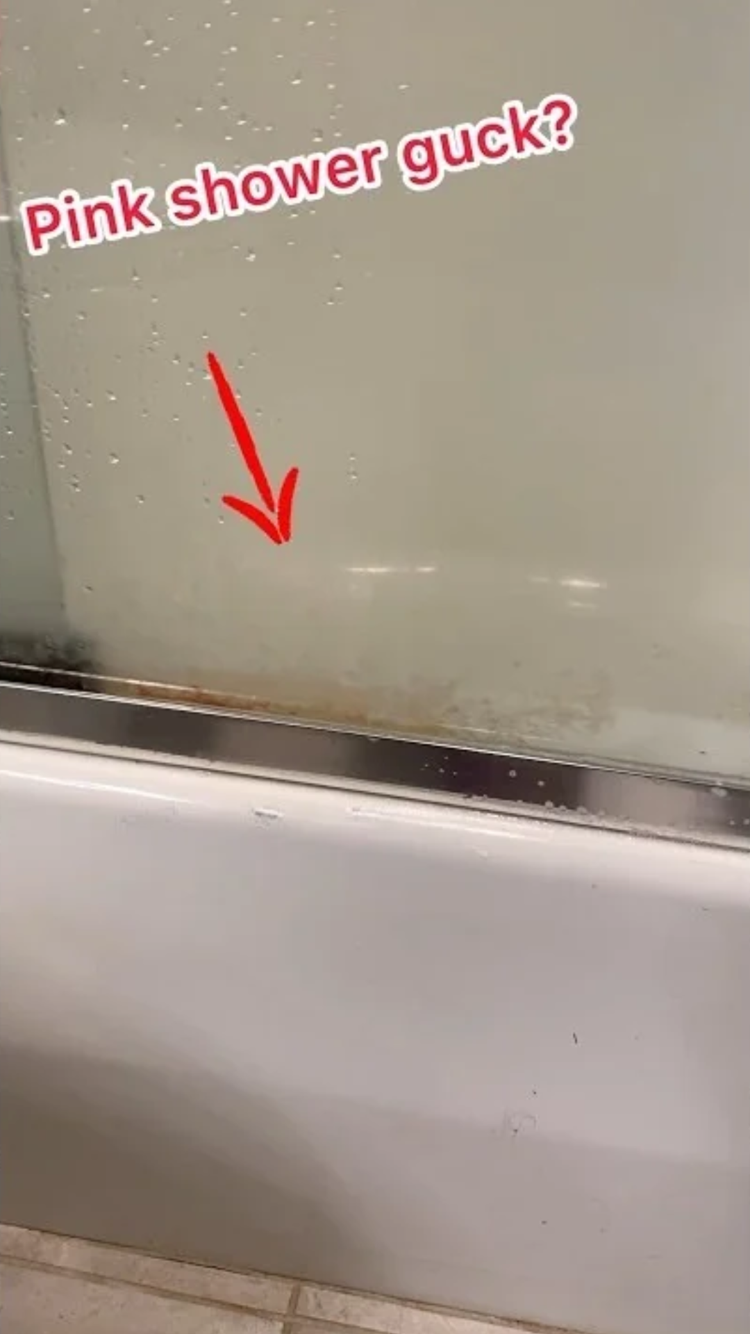 Removing stubborn pink buildup from a shower