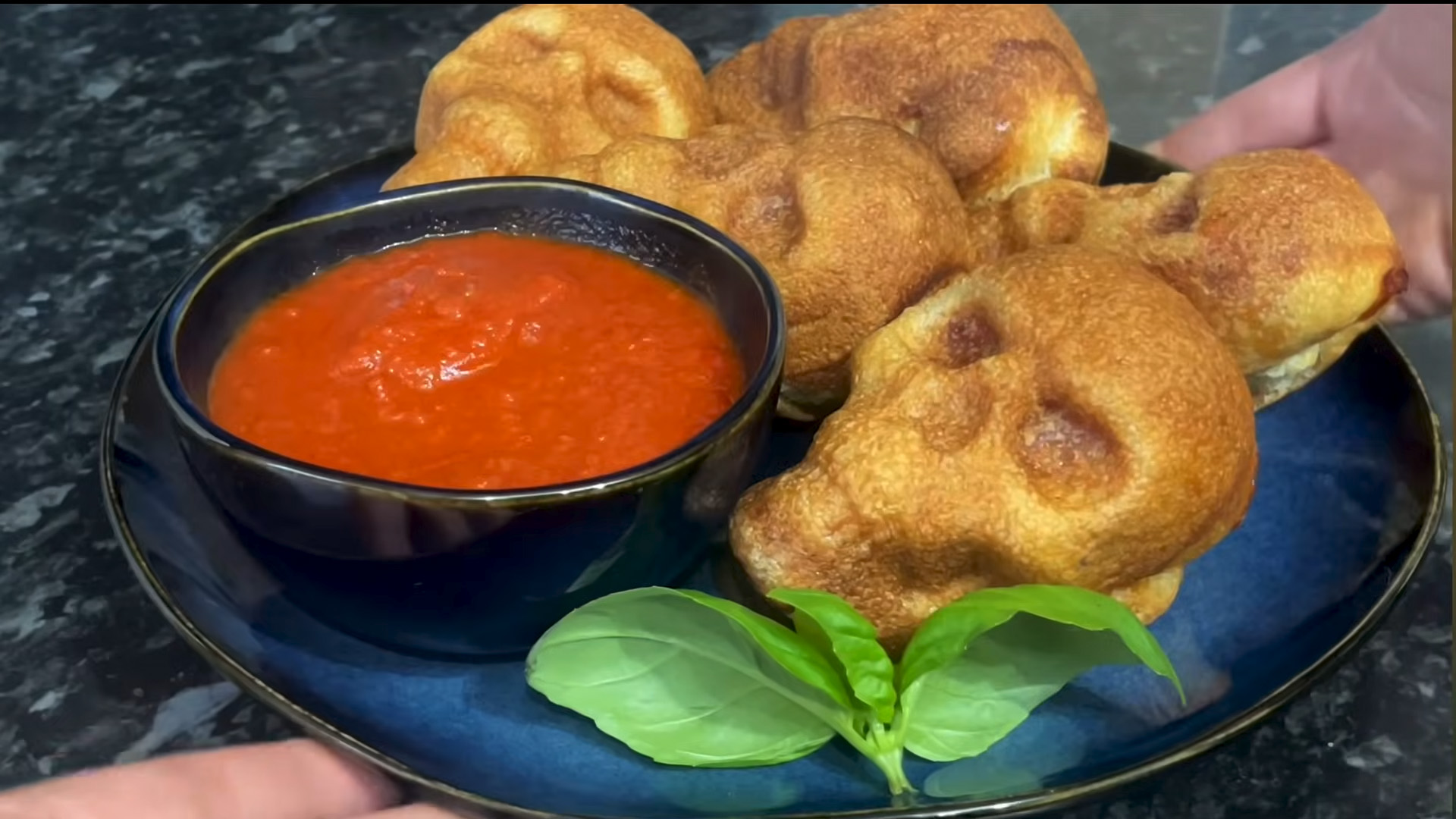 Making easy and delicious spooky Halloween pizza skulls at home
