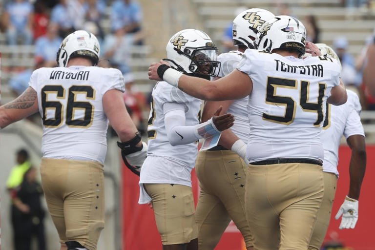 UCF riding high off upset win as interim coach brings Baylor to town