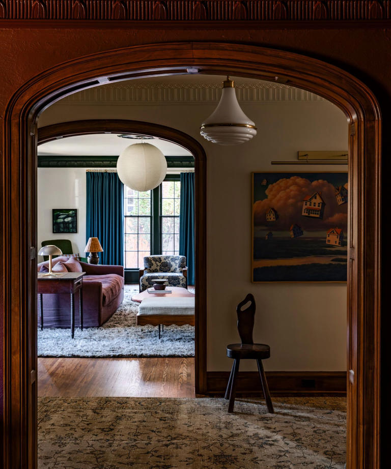 Inside a colorful living room with a moody, unexpected palette