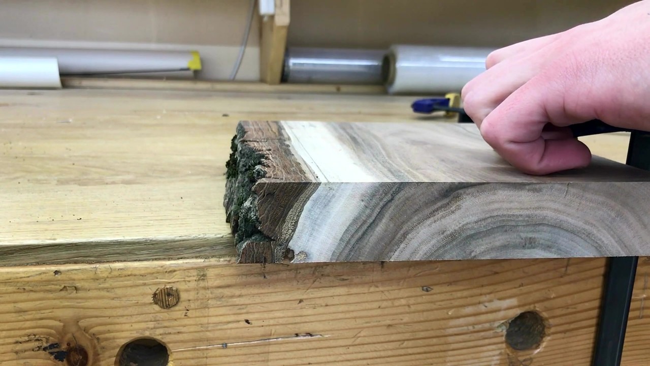 Woodworker builds a walnut tablet stand