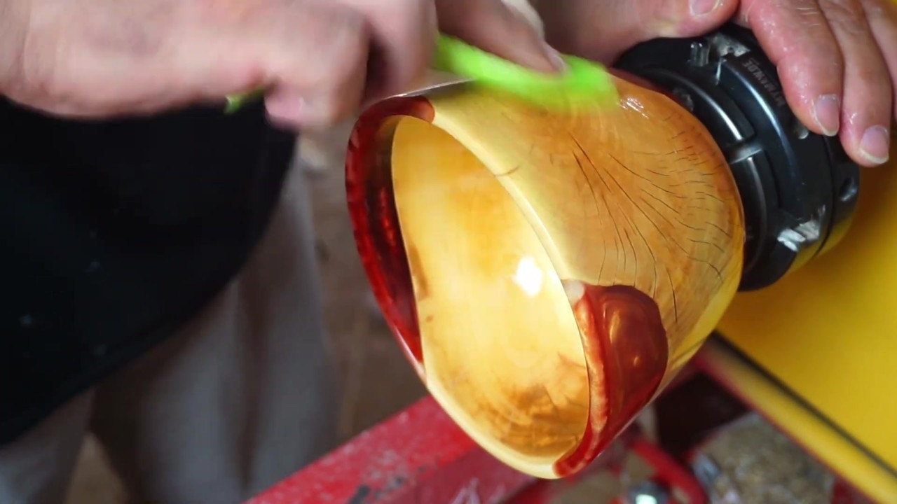 Pear wood bowl with a glossy red resin band