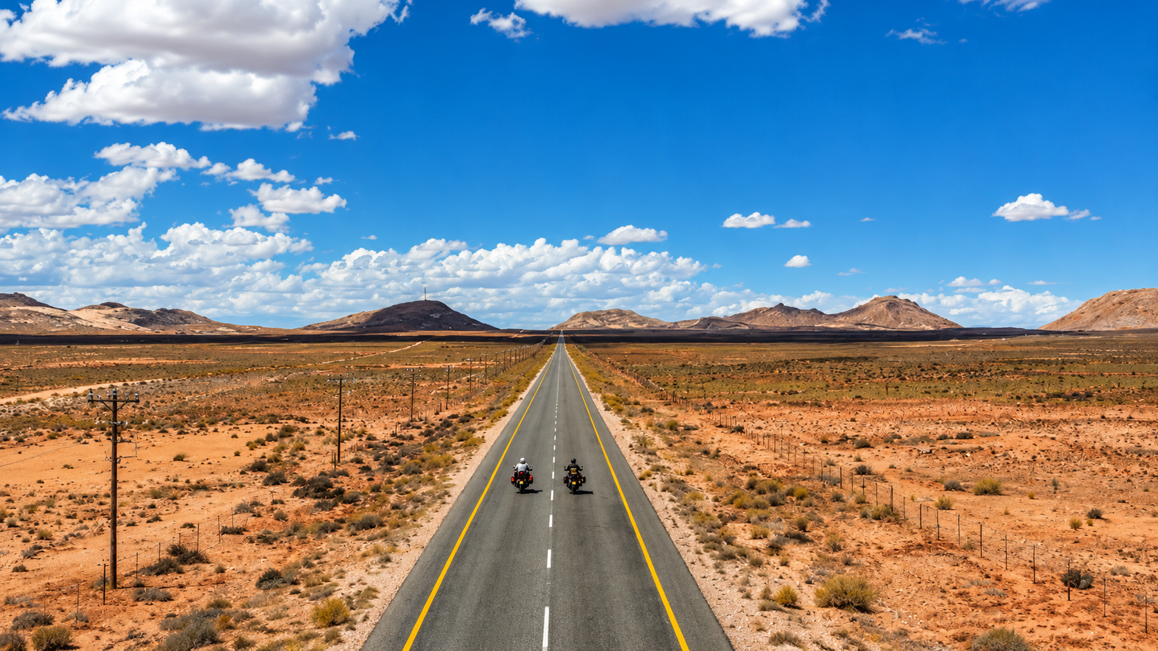 Riding a motorcycle through Namibia's vast desert landscapes