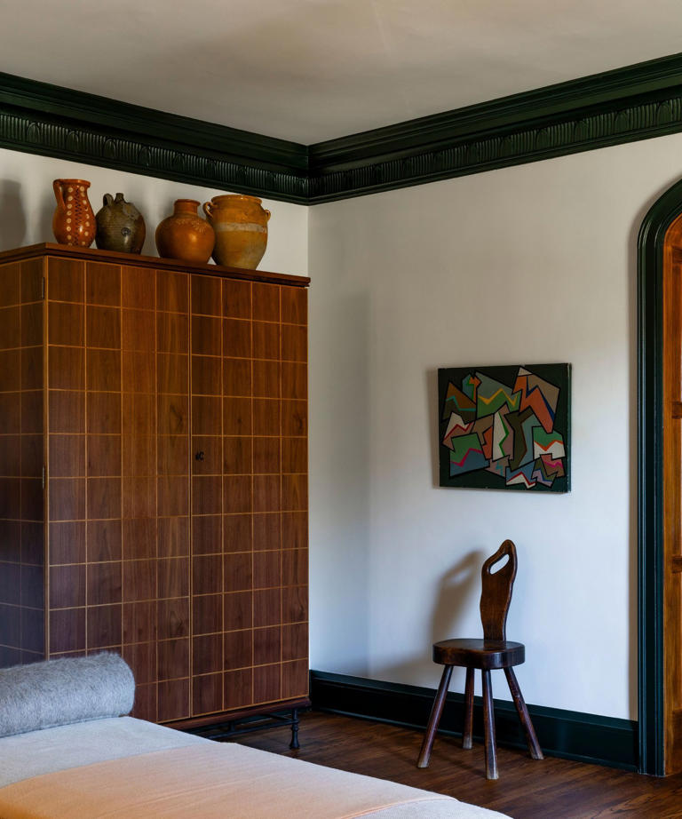 Inside a colorful living room with a moody, unexpected palette