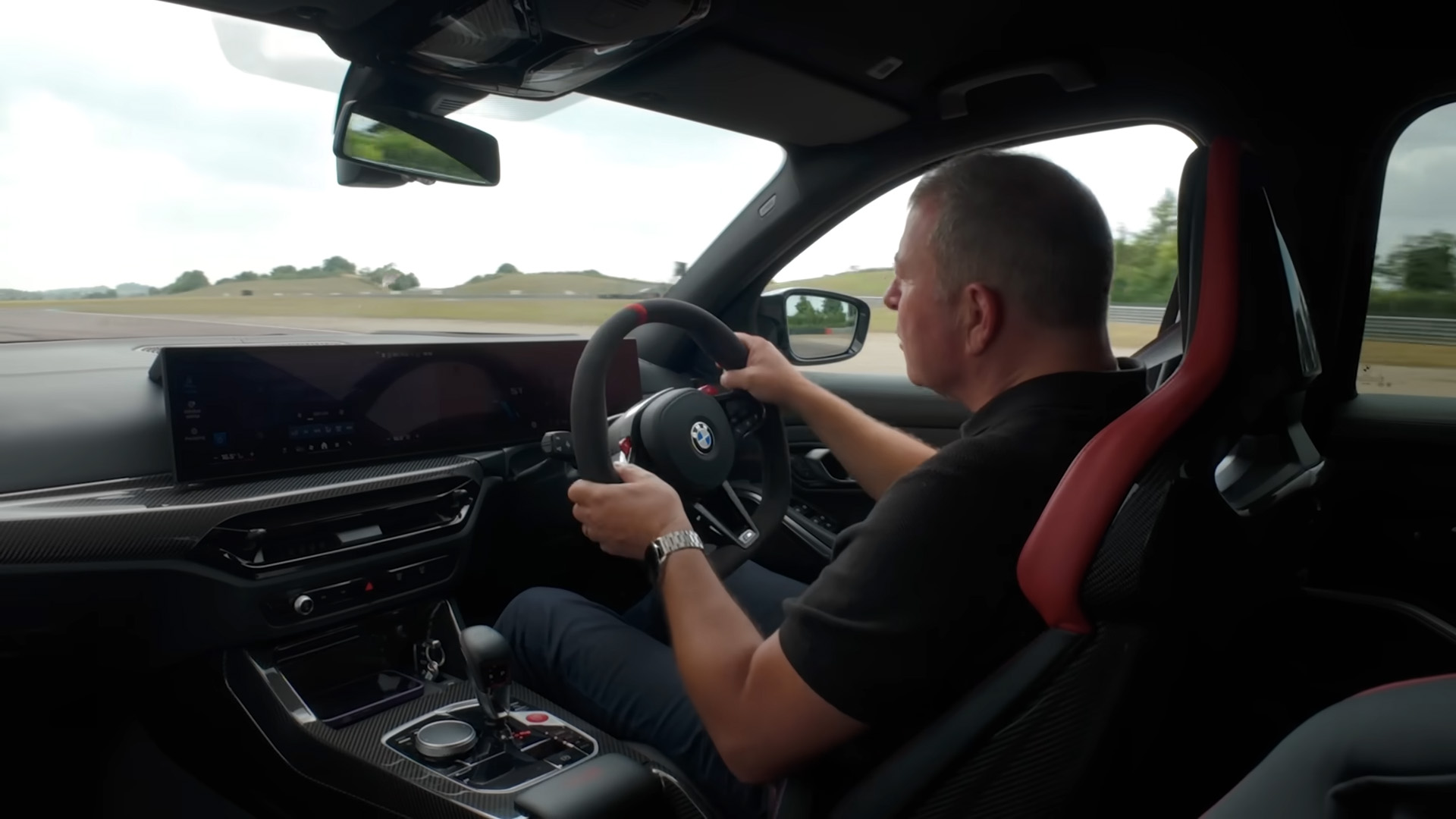 How do professional drivers master rear wheel drive cars on track?