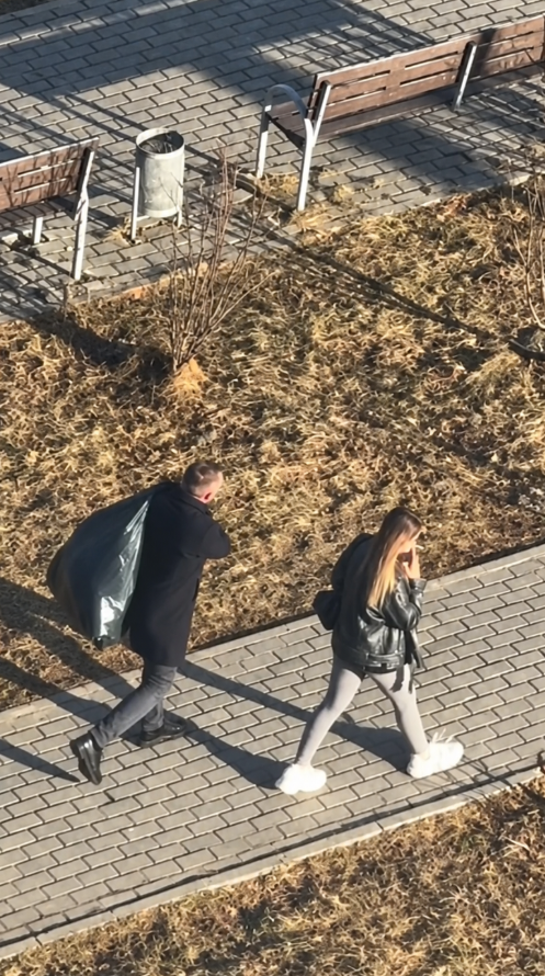 Garbage bag bursts open while man handles household chores