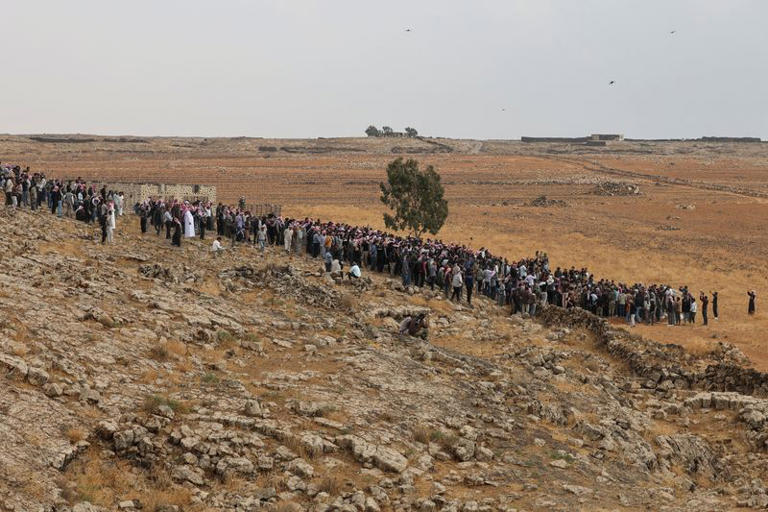 Mourners gather during the funeral of four members of the same family, including three children, who were killed in a reported Jordanian airstrike in the town of Al-Mismiyah, in Syria's southern Daraa province, October 27, 2026. REUTERS/Khalil Ashawi