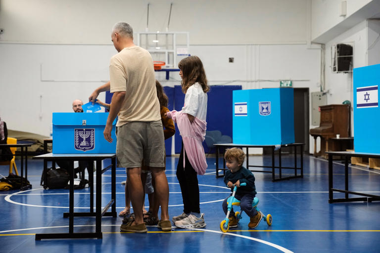 Israelis head to the polls with Netanyahu’s future at stake, in photos