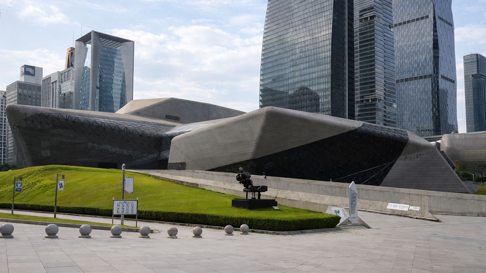 Giant folded roof stands among Guangzhou's glass skyscrapers