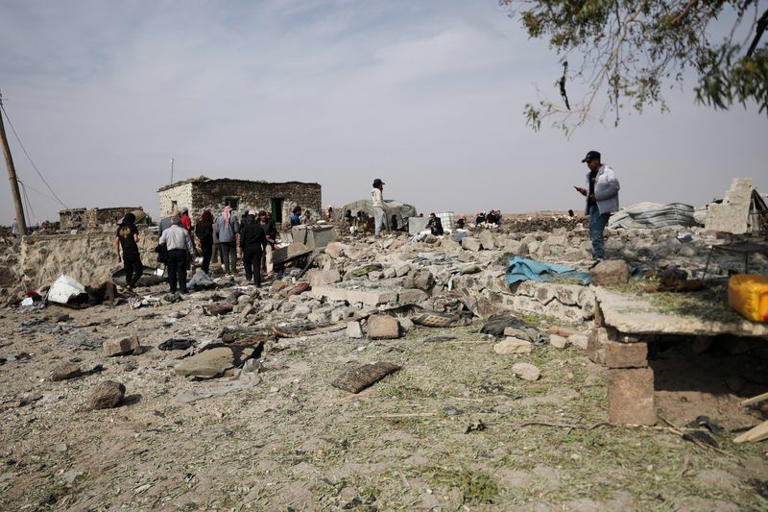 People inspect the site of a reported Jordanian airstrike where four members of the same family, including three children, were killed, in the town of Al-Mismiyah, in Syria's southern Daraa province, October 27, 2026. REUTERS/Khalil Ashawi