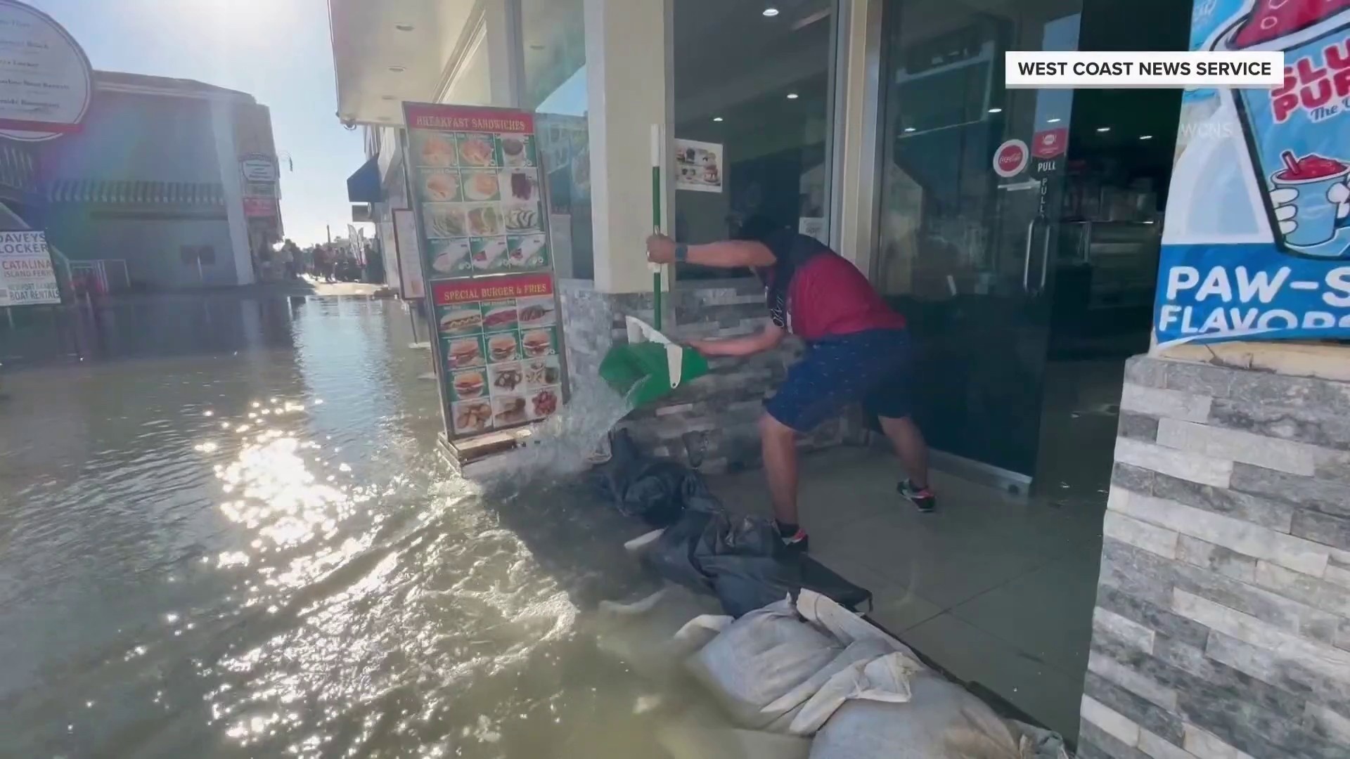 Powerful king tides flood coastal communities on both coasts