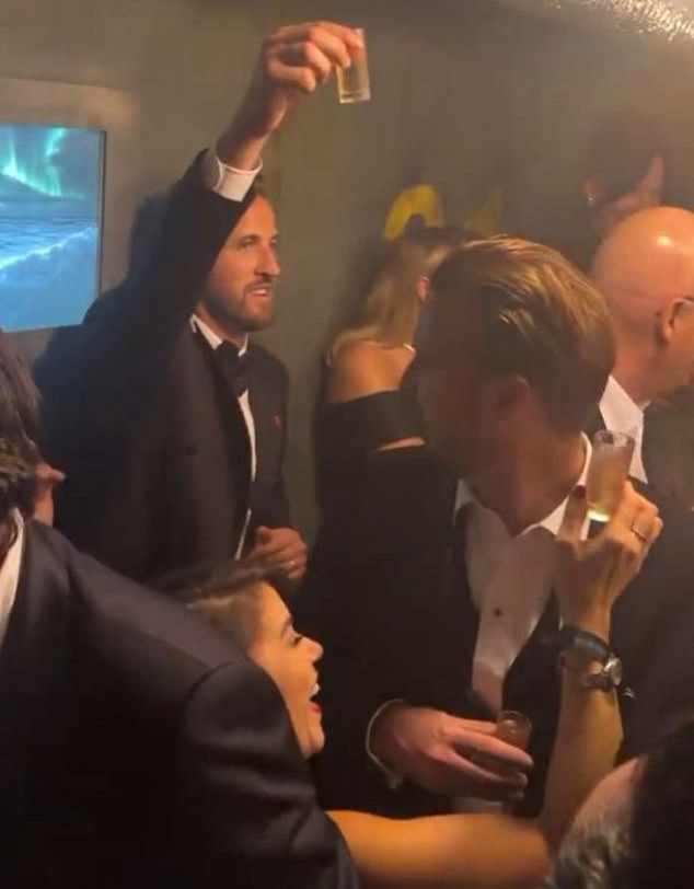 Kane raised his shot glass of champagne to the friends and family celebrating his Ballon d'Or win in Cirque de Soir in Soho on Monday night as the afterparty took off