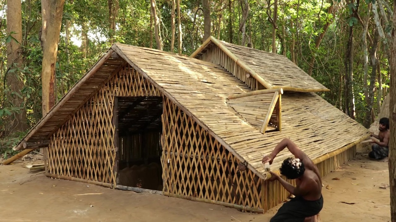 Underground bamboo villa with layered roofs