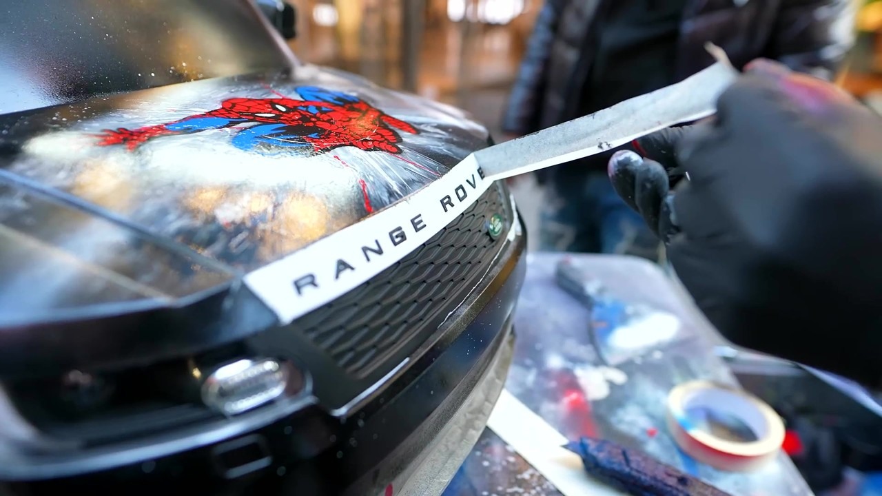 Street artist spray paints my Range Rover