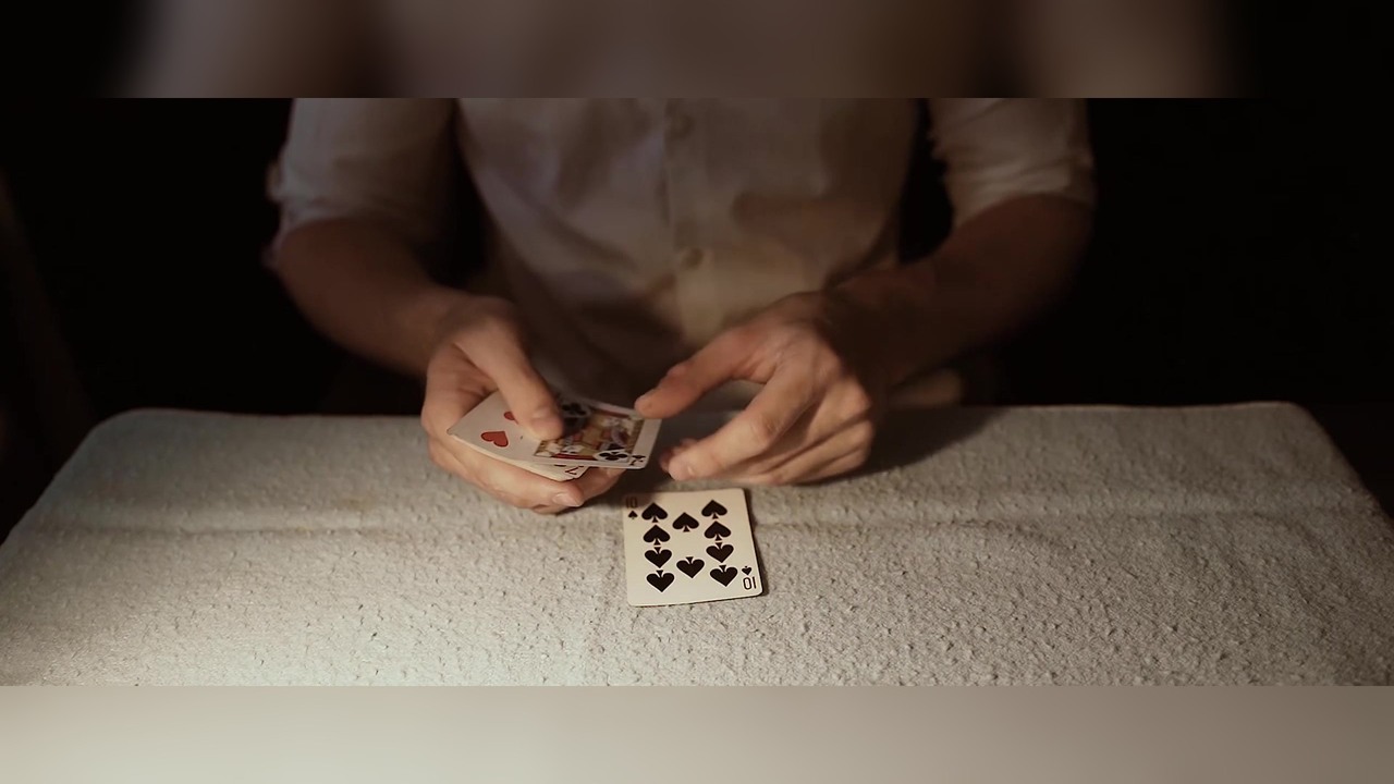 Donald Trump chooses the red-backed card in a card trick