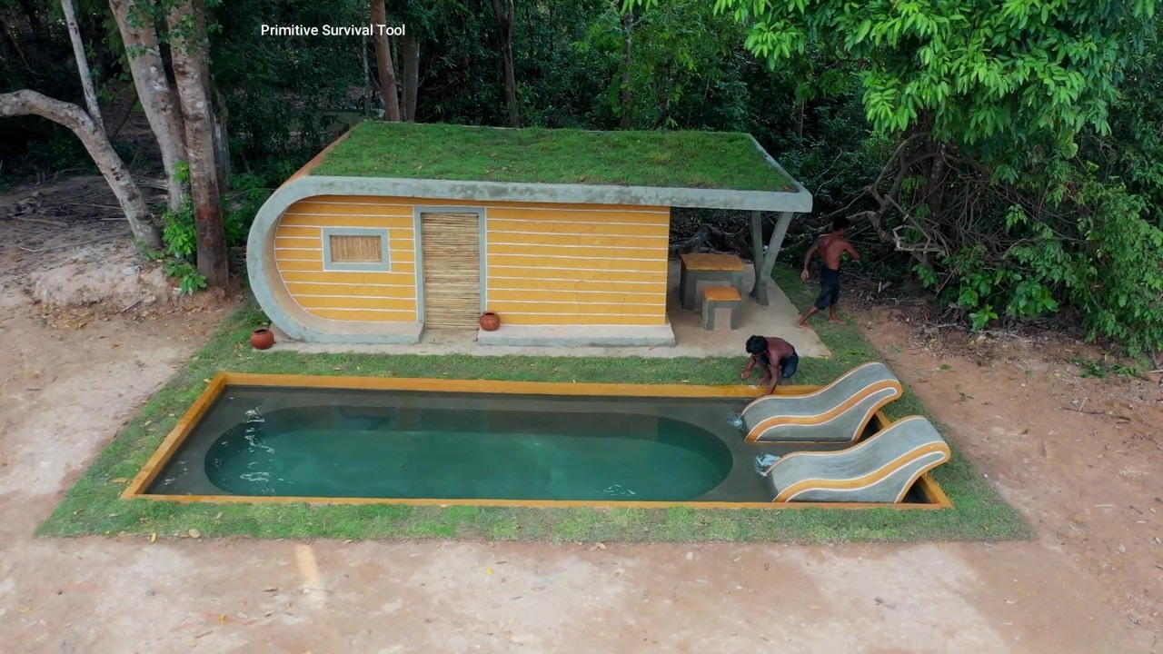 Yellow Cabin With Curved Slides Into the Pool