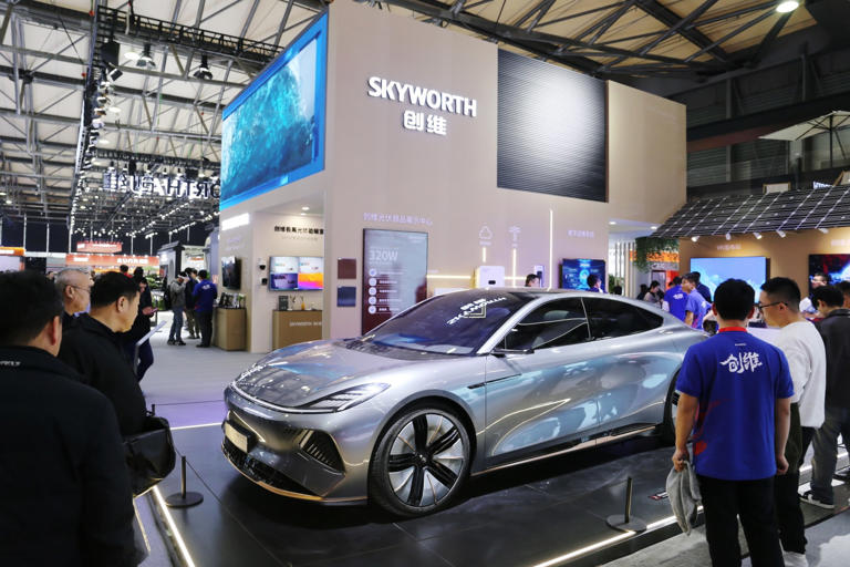 Skyworth Auto unveiling an all-electric sedan in Shanghai in 2024.