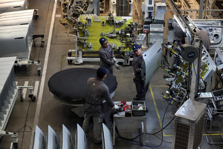 Workers on the production line of EV maker Nio in Hefei in 2025.