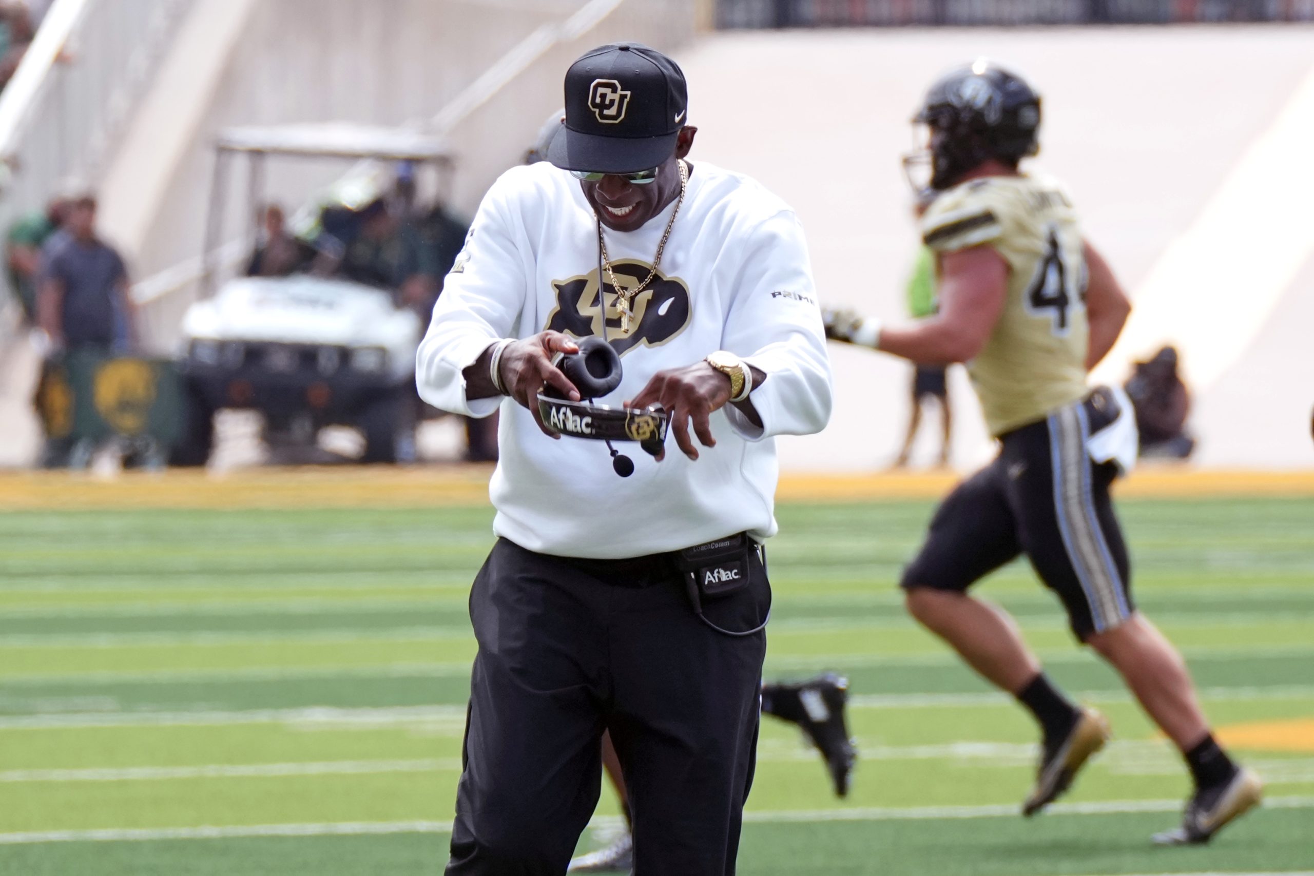 Deion Sanders says he was joking about offering money to silence critics