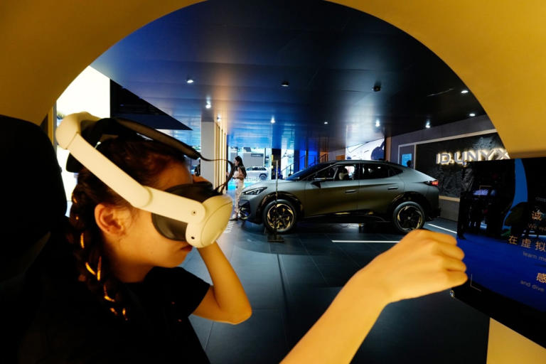 Volkswagen offered a virtual-driving experience when it displayed an electric vehicle at the Shanghai Auto Show in 2025.