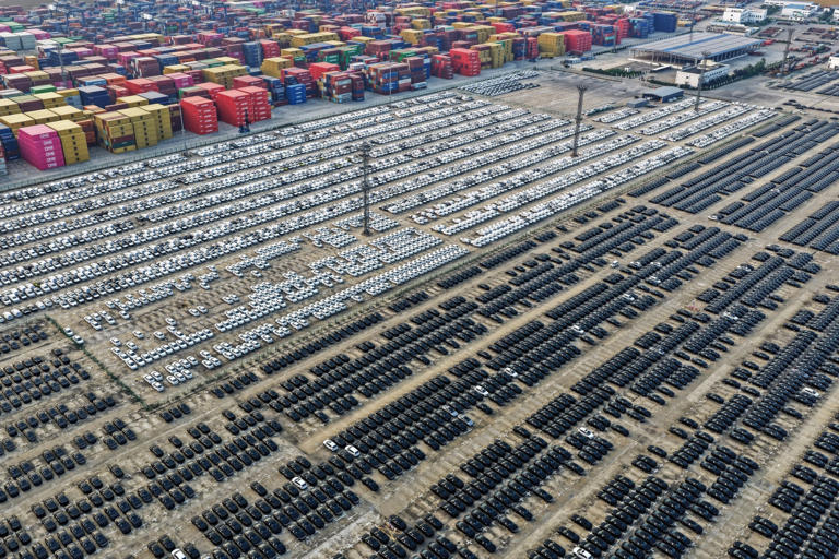 Chinese-made vehicles awaiting export at a port in Nanjing in 2025.
