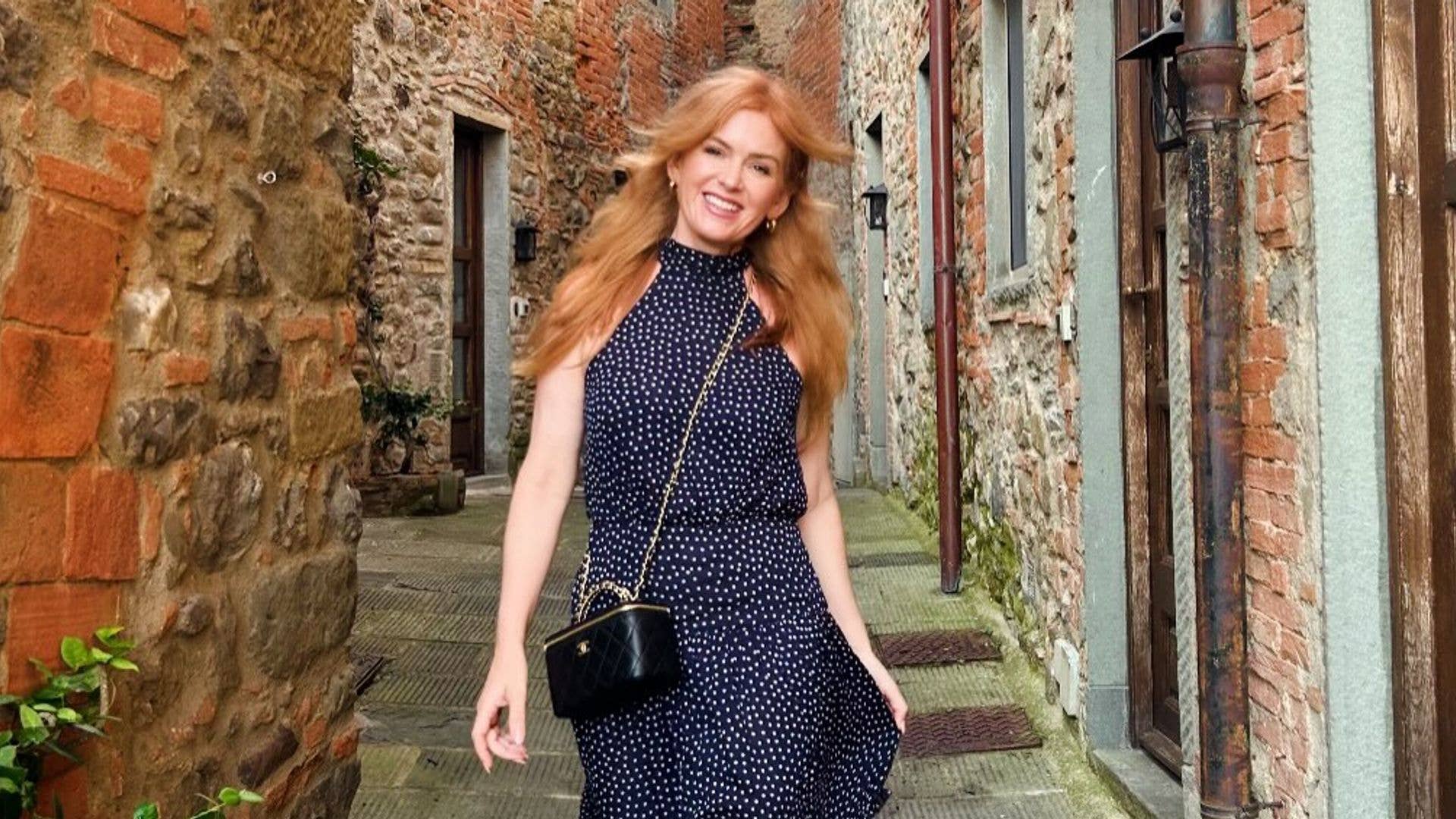Isla Fisher turns heads in leggy minidress and zebra-print boots for ...