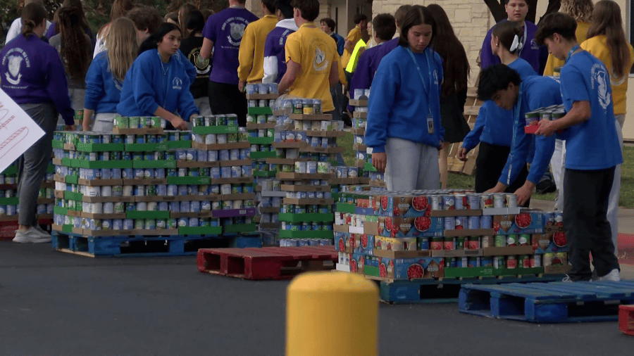 Bishop Carroll students haul in 'amazing' 30,614 cans in food drive
