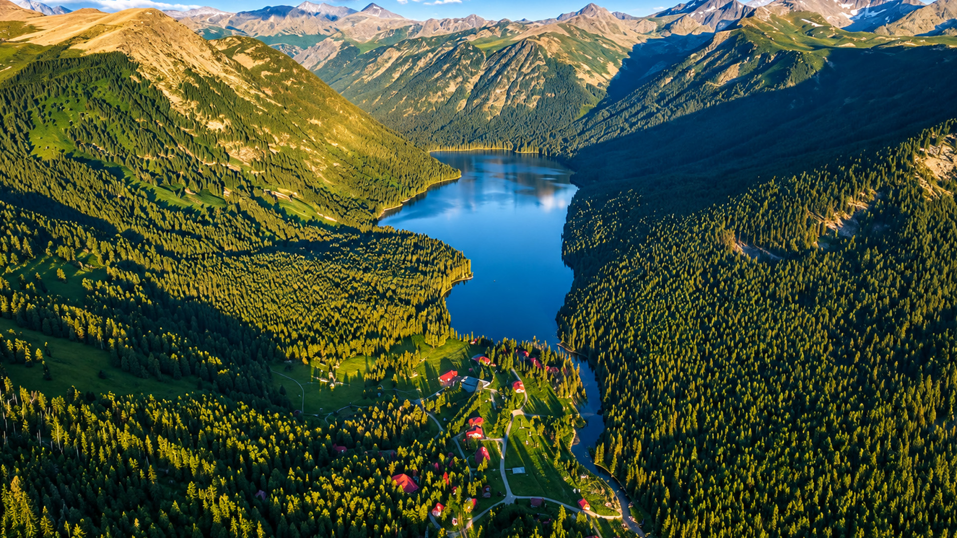 Small houses scattered along a remote mountain lake