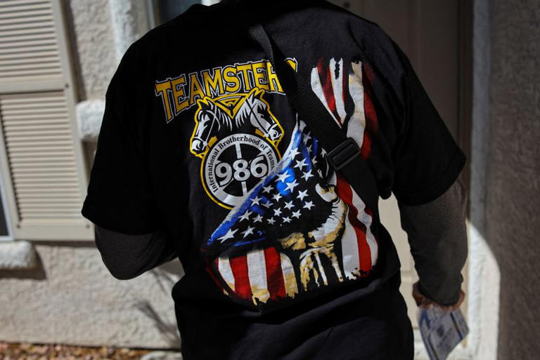 Teamsters member Larry Goldfinger, 63, wears a Local 986 shirt as he canvasses Teamsters members' homes ahead of the midterm elections in Las Vegas, Nevada, US, October 2, 2026. Goldfinger said he worries the rise of AI in Las Vegas will not only cost the city lots of jobs, but also ultimately hurt business by making it less welcoming to tourists accustomed to interacting with well-trained hospitality staff. "We are not against the changes," he said. "We just want to make sure we are involved in how it's changing." REUTERS/Daniel Cole