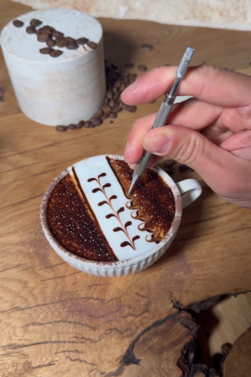 Beautiful chocolate patterns on a cup of coffee