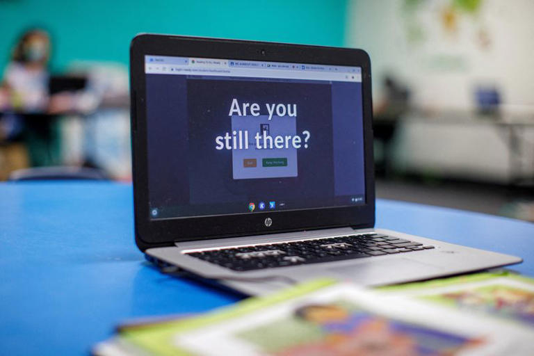 FILE PHOTO: A young student's school computer sits waiting for attention in Los Angeles, California, U.S., March 2, 2021. REUTERS/Mike Blake/File Photo