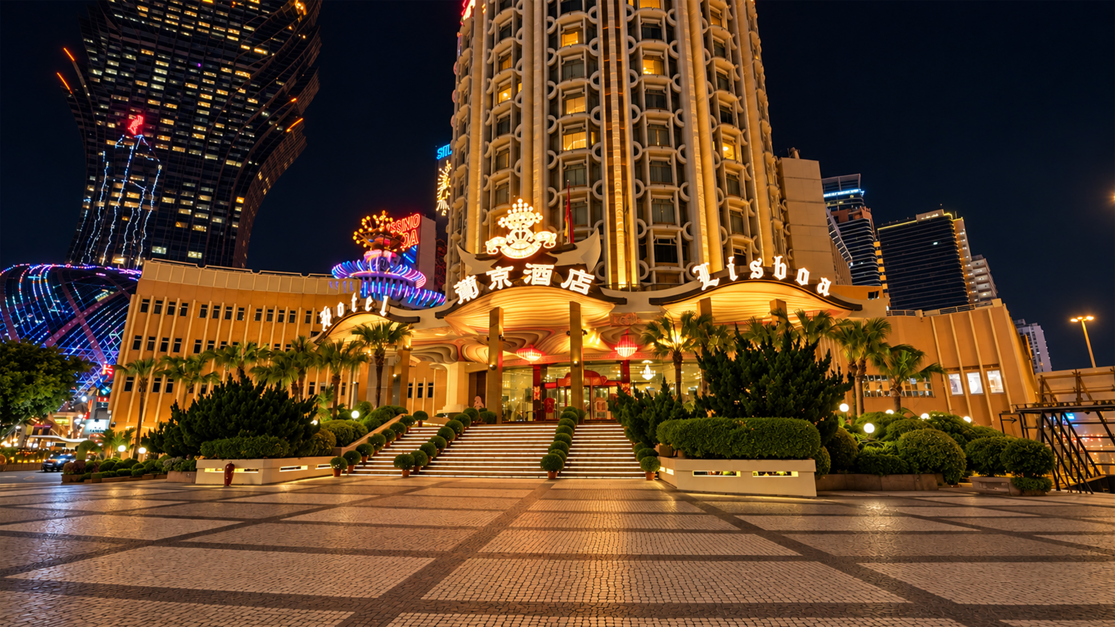 Lisboa hotel's golden staircase shines beneath Macau's night skyline