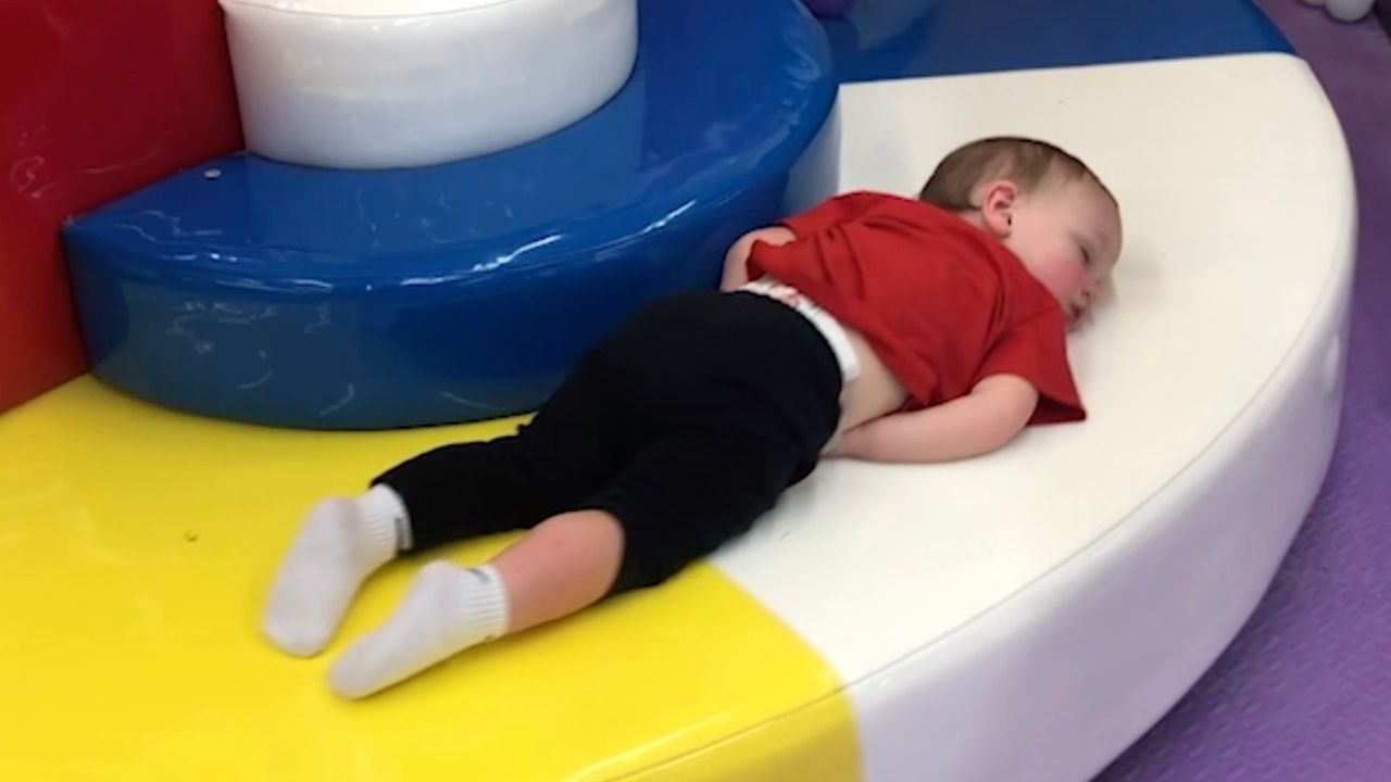 Toddler falls asleep on merry go round | Happily