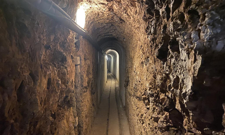 House with underground network of passages dug for family fun sells for ...