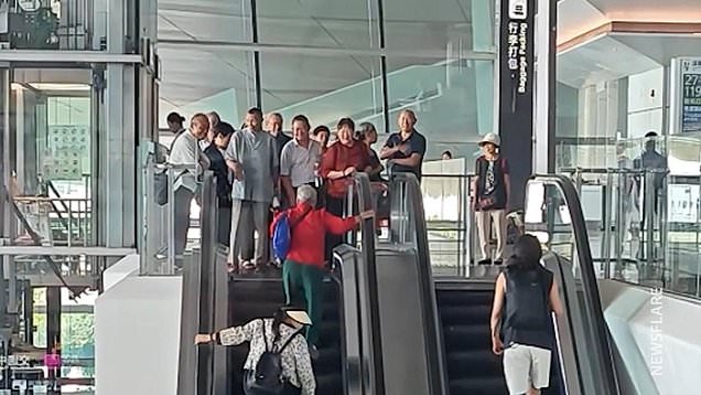 Stubborn elderly people walk wrong way up escalator