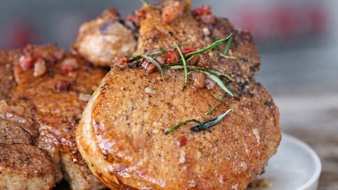 Thick-cut pork chops in a cast-iron skillet - A chef's cooking method