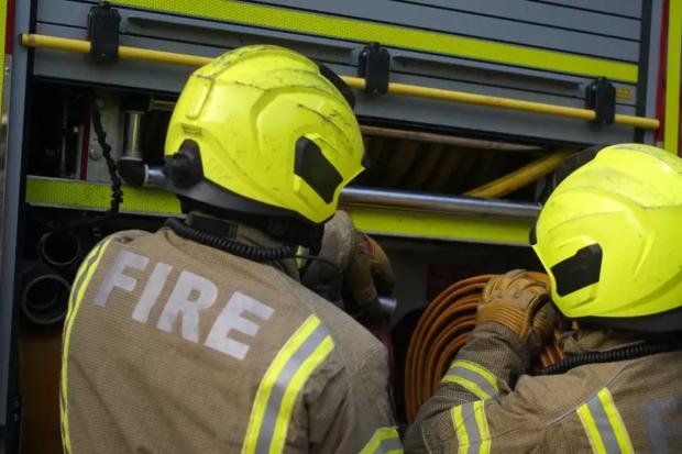 Firefighters rescue child from second floor as blaze rips through building