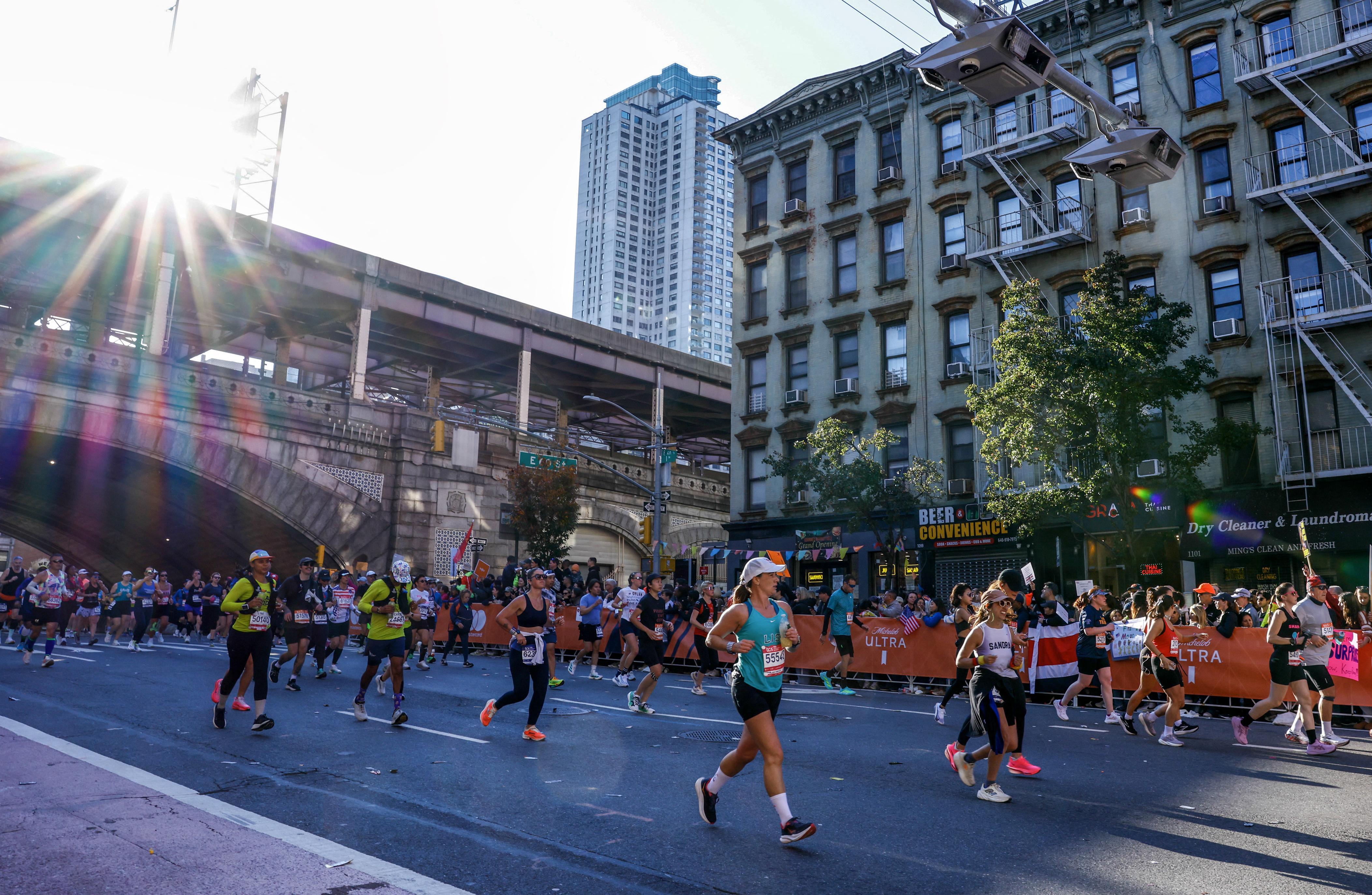 NY Road Runners paint TCS marathon blue line