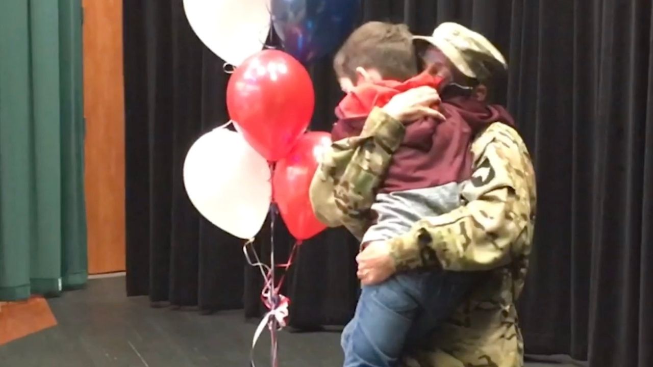 Apache pilot surprises son at school | Happily