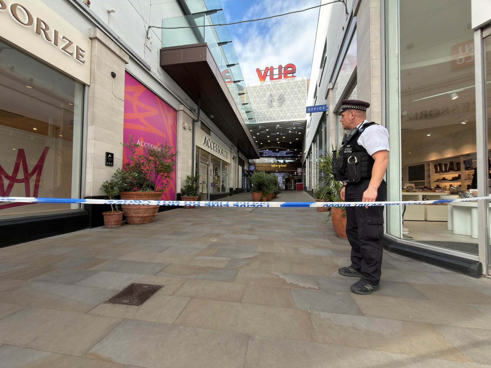 Gunmen open fire on 'busy' shopping centre injuring two in north London