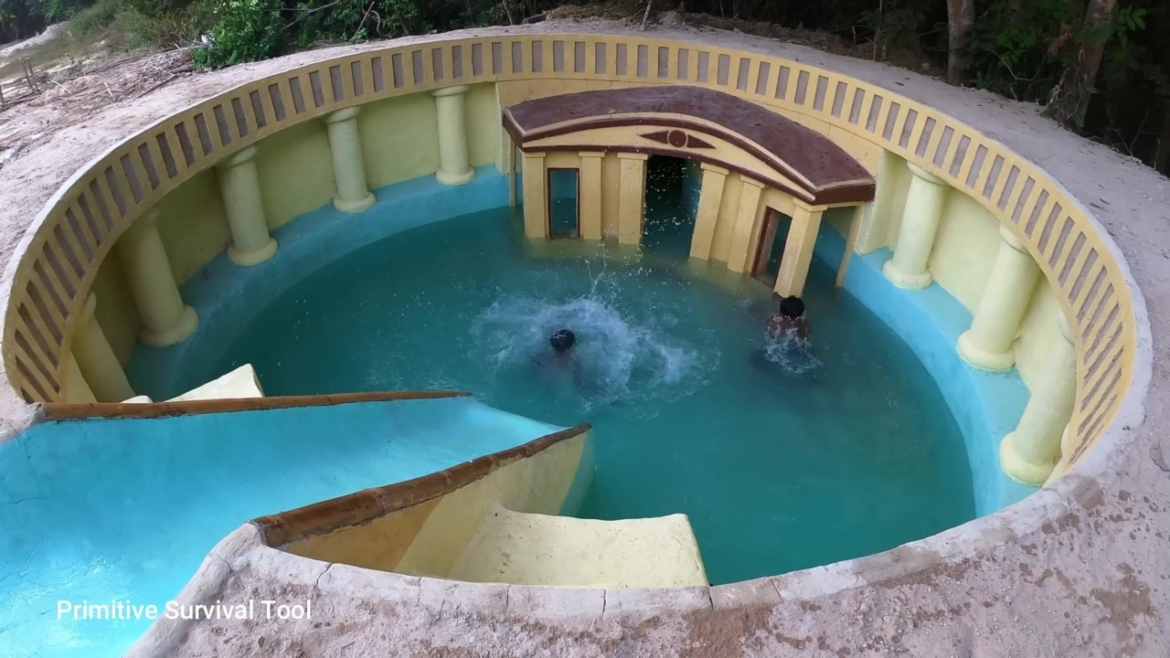 Pool below a water slide in an underground temple house
