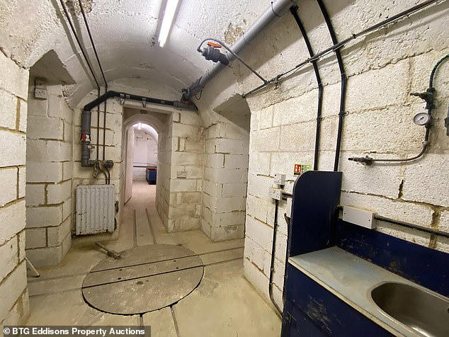 House with underground network of passages dug for family fun sells for ...