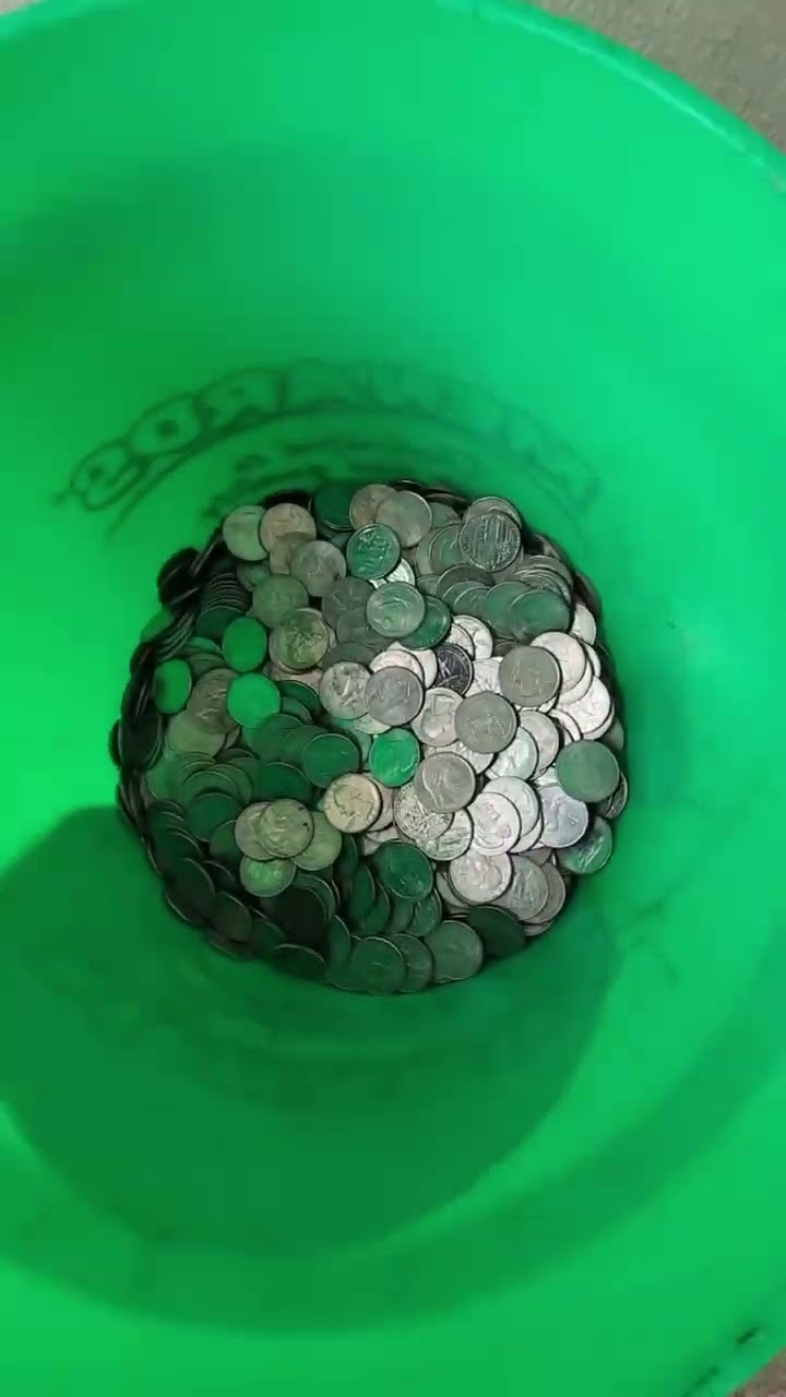 Carwash owner collects quarters from machines