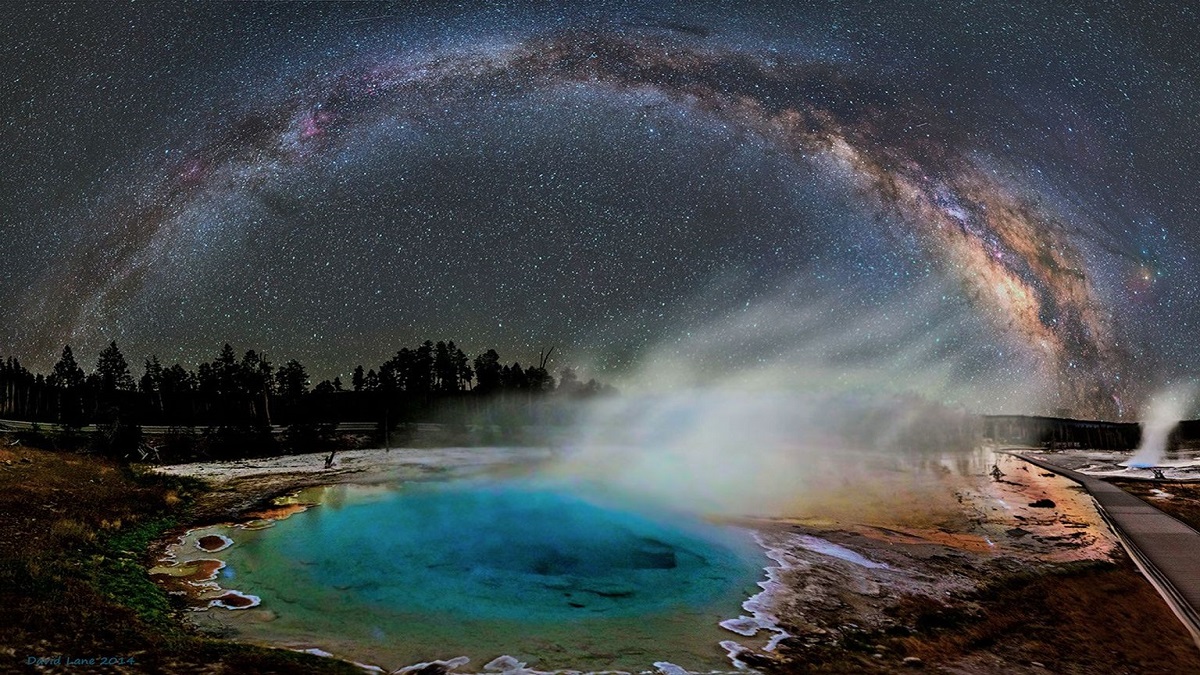 Milky Way arches over Yellowstone hot spring