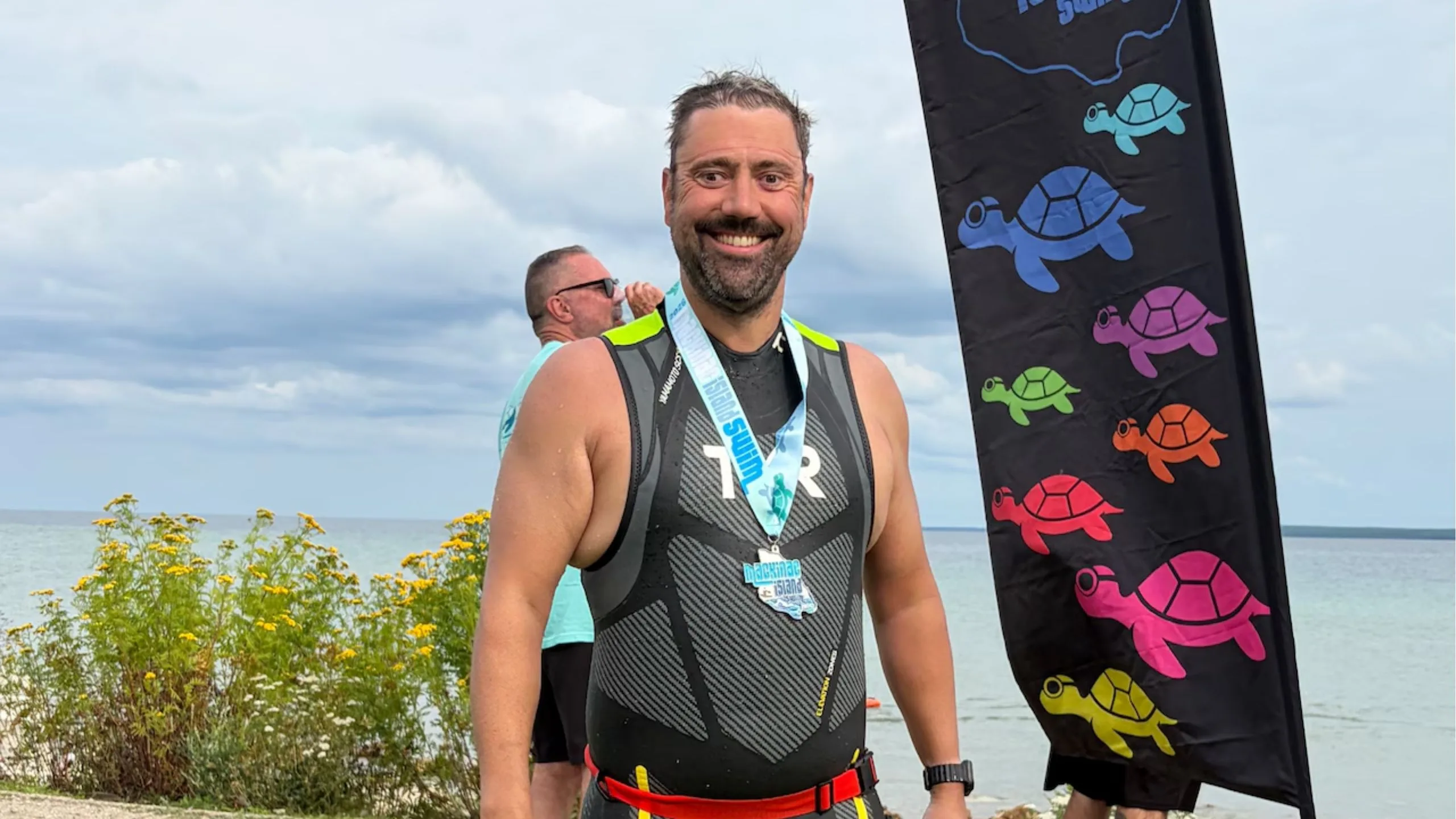 Michigan athlete becomes first blind swimmer to circle Mackinac