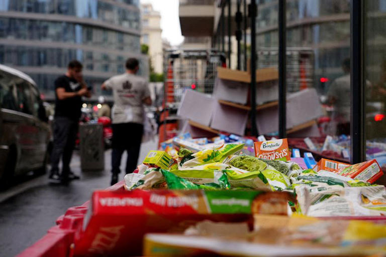 Boxes of perished goods are seen outside an Intermarche supermarket in Paris the day after a cyberattack targeted refrigeration systems at French supermarket chains, causing food losses and fires at several stores, France, October 13, 2026. REUTERS/Lucien Libert/File Photo