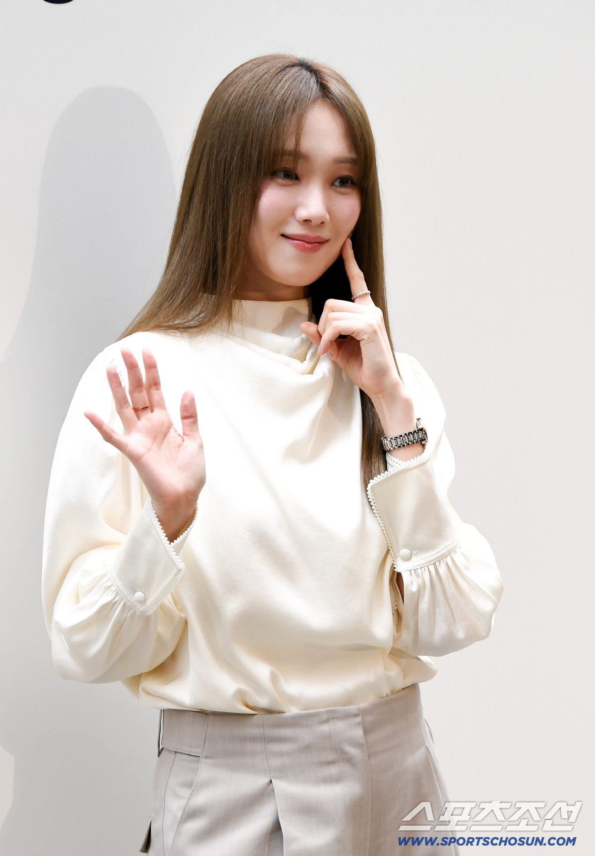 Lee Sung-kyung poses with a finger poking her cheek