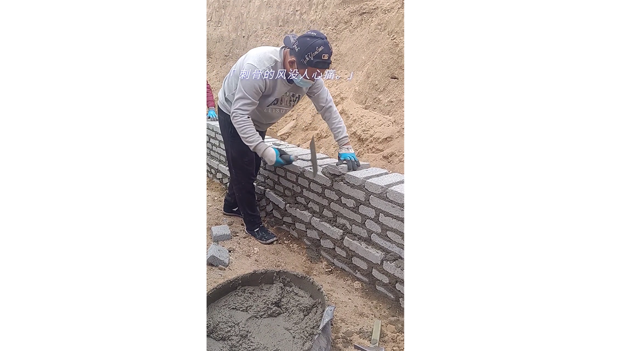 Building a sturdy brick wall by carefully stacking gray blocks
