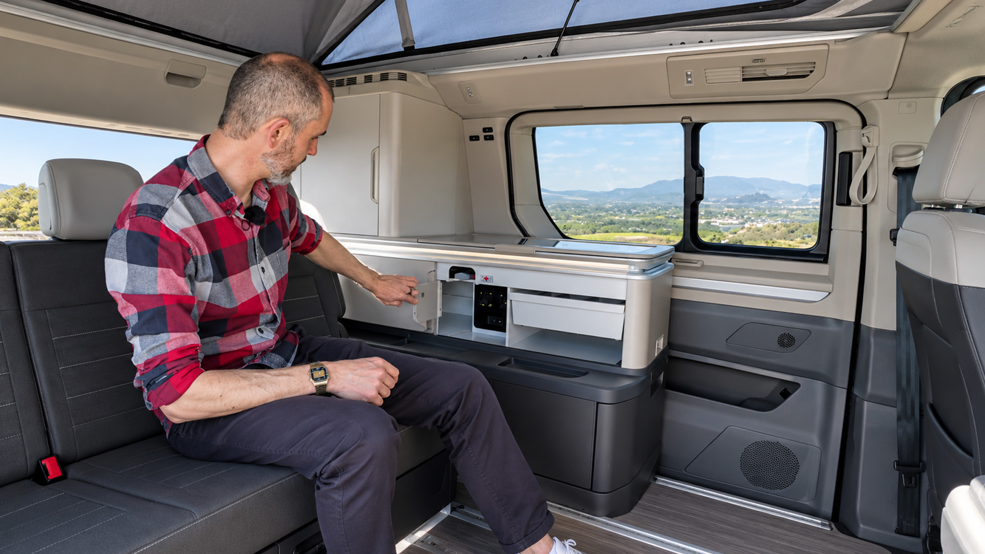 Volkswagen California T7 showcases a compact kitchen with organized ...