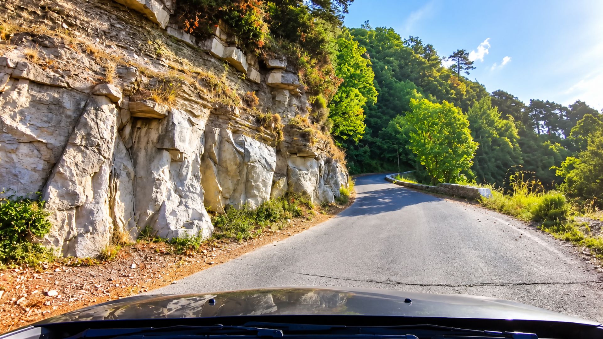 A scenic drive along rocky cliffs in the French Alps (4K)